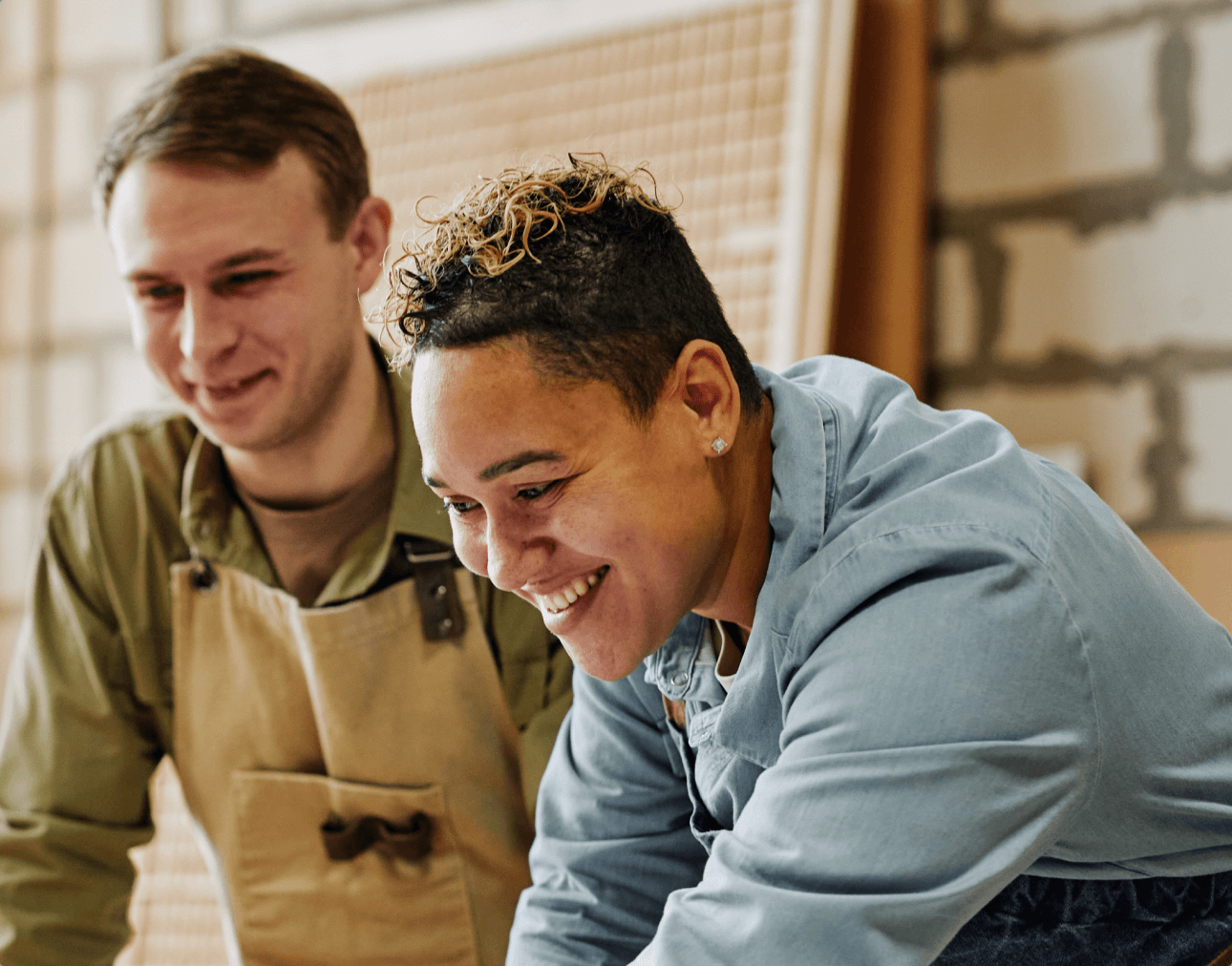 Balance B2C & B2B Commerce Case Study, Mitre 10 - two people in tool workshop working on a project