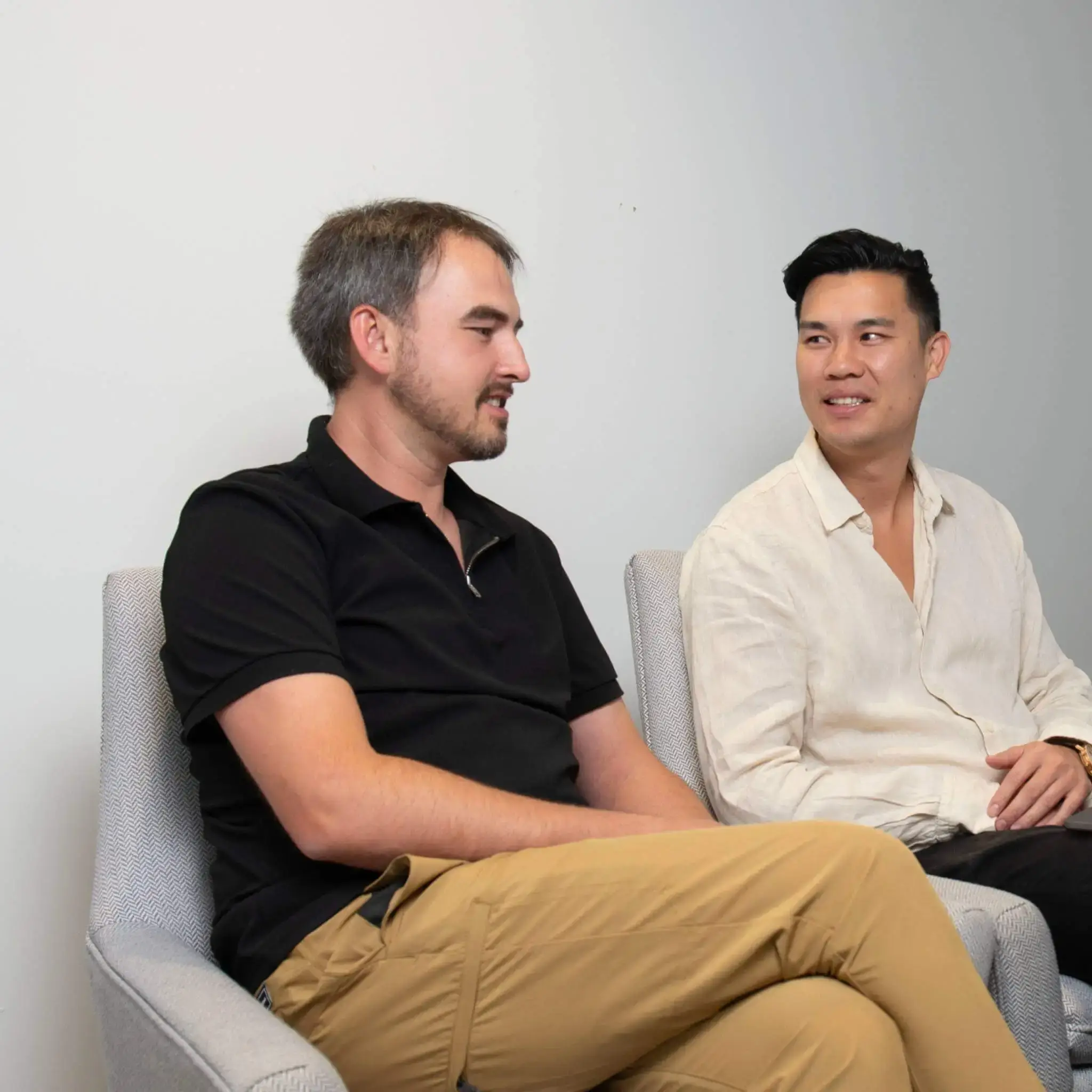 Feature-rich Adobe Commerce accelerator, two people sitting and chatting in the office